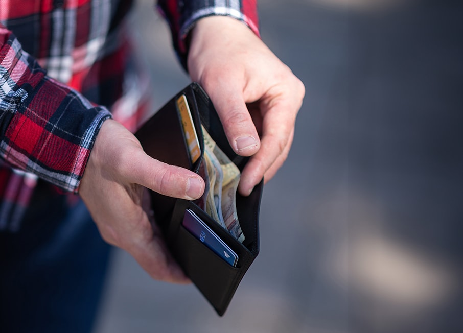 Person holding and opening wallet in hands landscape